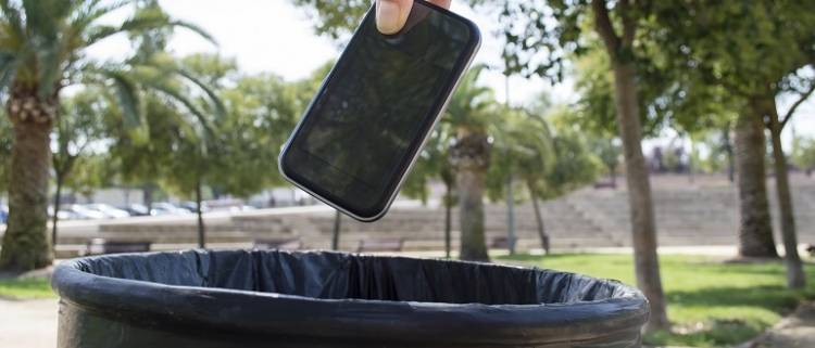 smartphone into trash